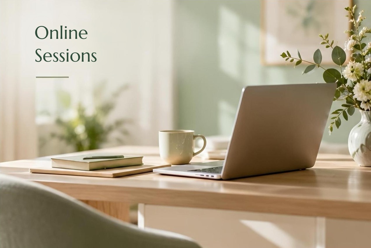 Online sessions: a desk with a laptop, a cup and flowers